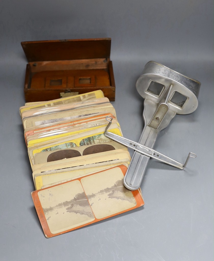 A stereoscopic viewer ‘The “Perfecscope”’ by H.C. White Co., another mahogany viewer and a quantity of mostly topographical cards including France, Italy and America